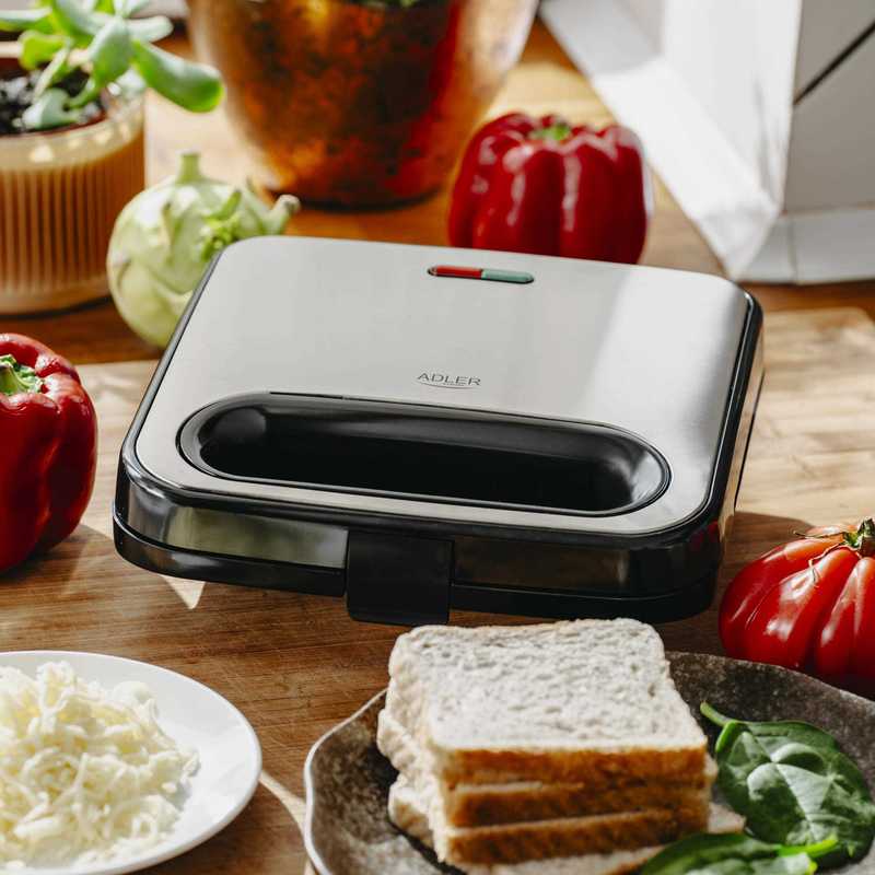 Efficient 1000W Sandwich Grill: Crispy Triangles in Minutes! Non-Stick Plates, Insulated Handle, and Vertical Storage – Perfect for Quick Snacks, Compact Design in Silver-Black Efficient 1000W Sandwich Grill: Crispy Triangles in Minutes! Non-Stick Plates, Insulated Handle, and Vertical Storage – Perfect for Quick Snacks, Compact Design in Silver-Black