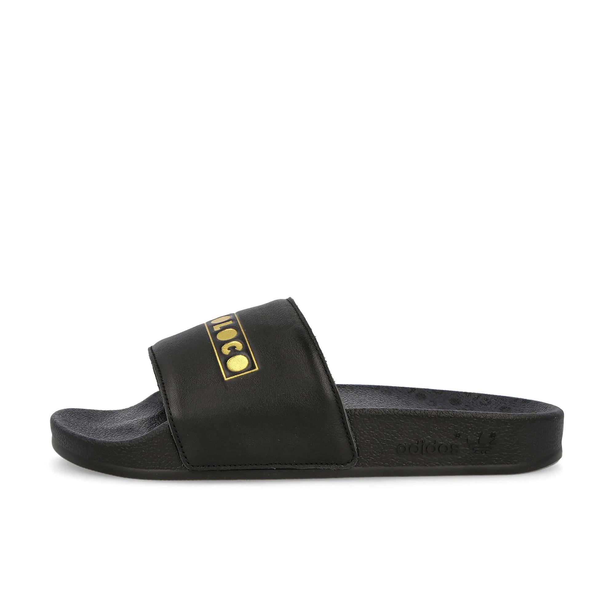 Image of Adilette Unisex Slip-on Slides In Black For Everyday Wear, Pool, Beach, And Post-workout