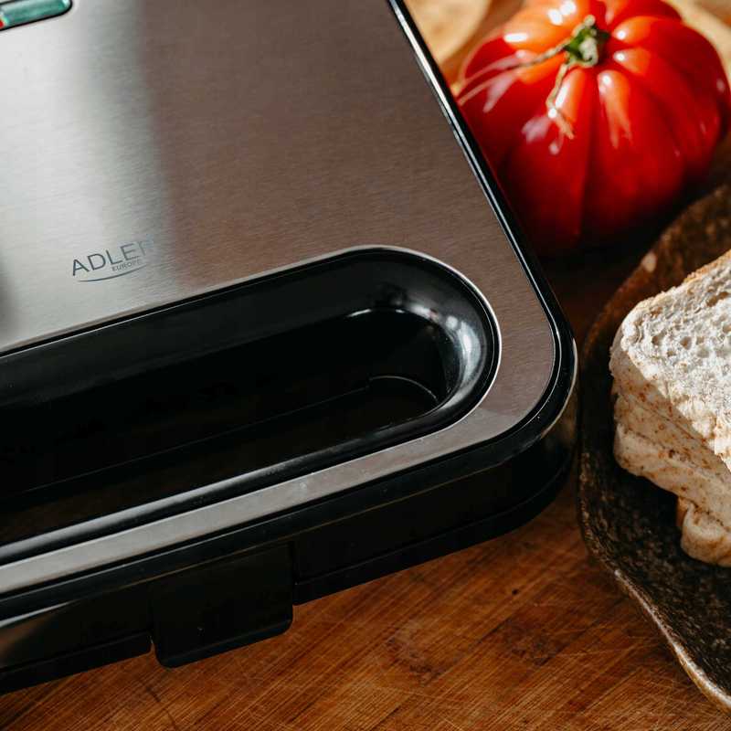 Efficient 1000W Sandwich Grill: Crispy Triangles in Minutes! Non-Stick Plates, Insulated Handle, and Vertical Storage – Perfect for Quick Snacks, Compact Design in Silver-Black Efficient 1000W Sandwich Grill: Crispy Triangles in Minutes! Non-Stick Plates, Insulated Handle, and Vertical Storage – Perfect for Quick Snacks, Compact Design in Silver-Black