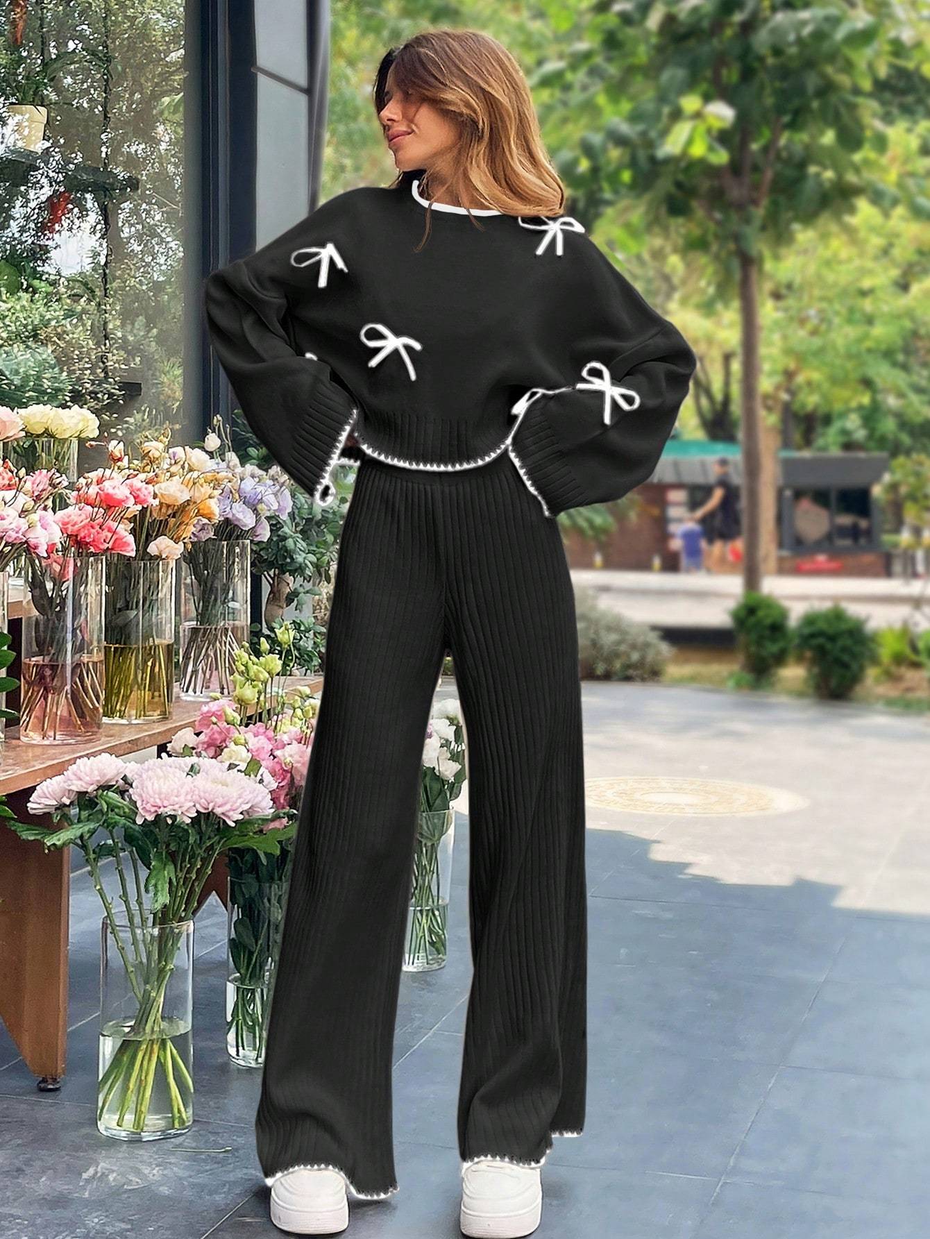 a 2pcs womens set consisting of a simple triko top with long sleeves, round collar, and   decoration, and pants. تفاصيل المنتج 3