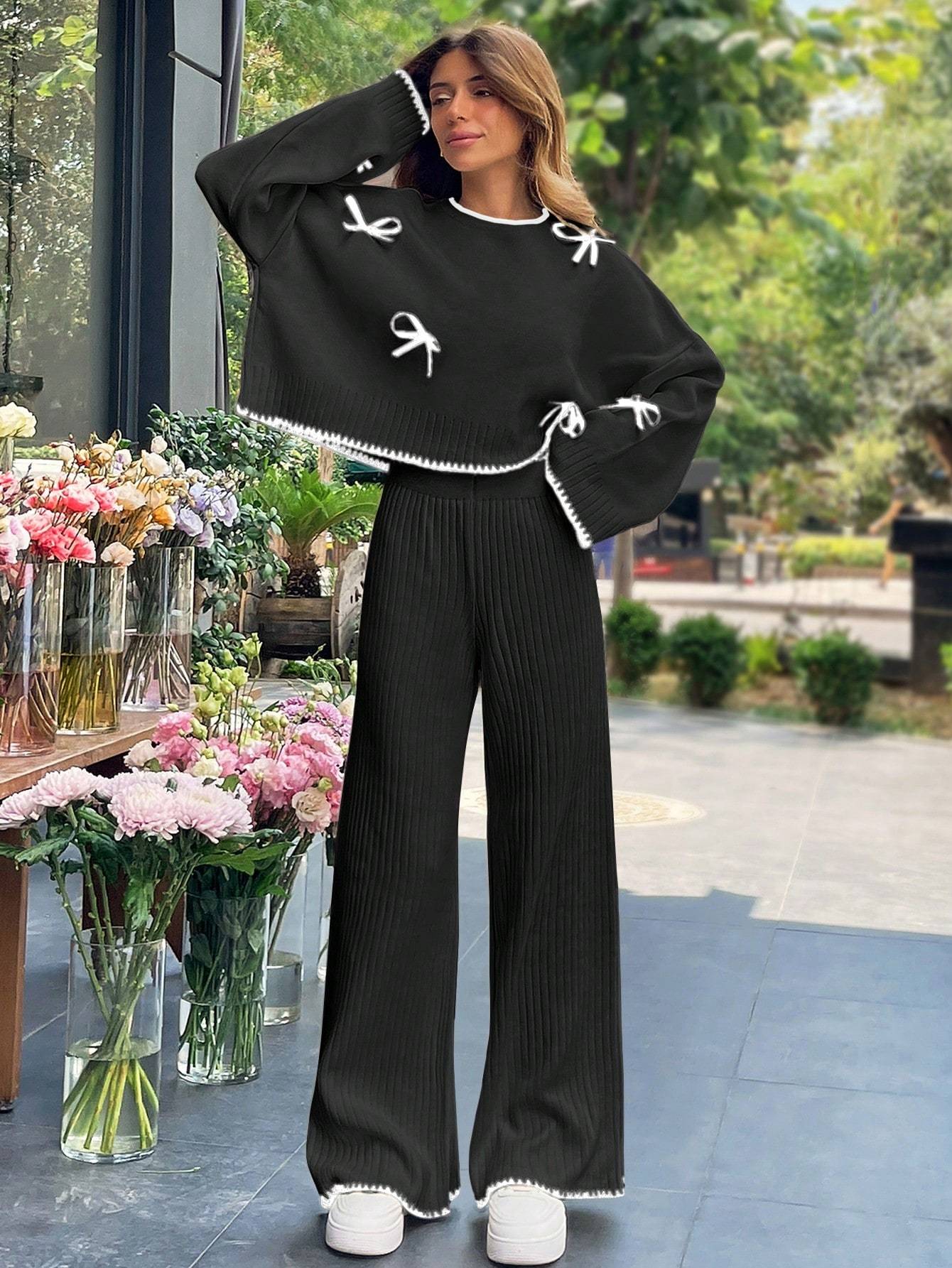 a 2pcs womens set consisting of a simple triko top with long sleeves, round collar, and   decoration, and pants. تفاصيل المنتج 2