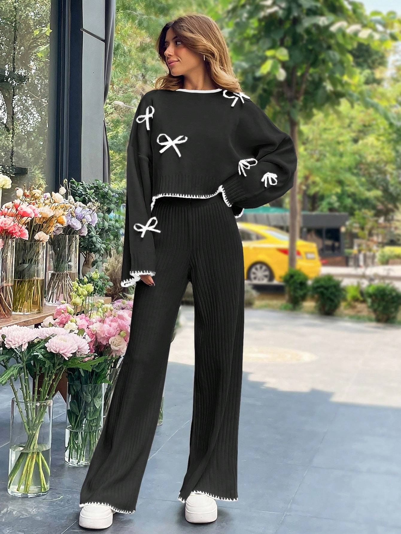 a 2pcs womens set consisting of a simple triko top with long sleeves, round collar, and   decoration, and pants. تفاصيل المنتج 4